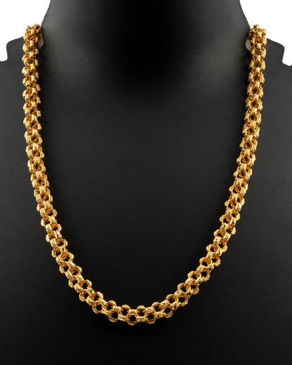 Gold chain necklace on a black mannequin