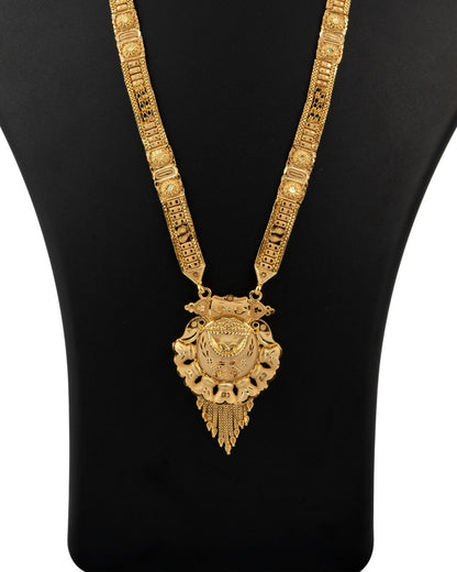 Gold necklace with intricate design on a black background