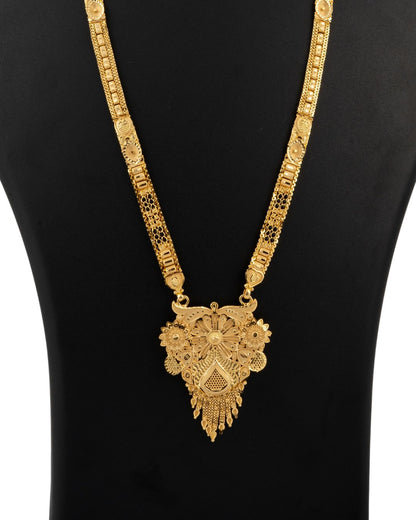 Gold necklace with intricate design on a black background