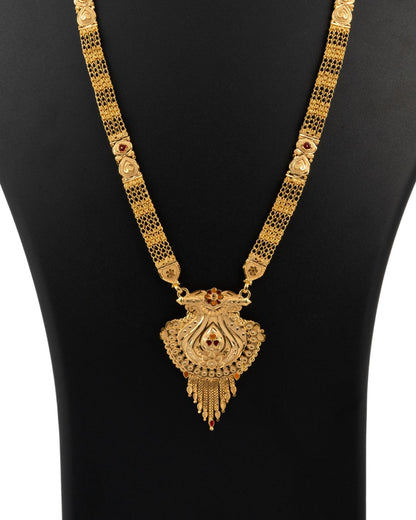 Gold necklace with intricate design on a black mannequin